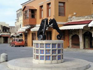 The fountain with three seahorses, Rhodes Custom Tours